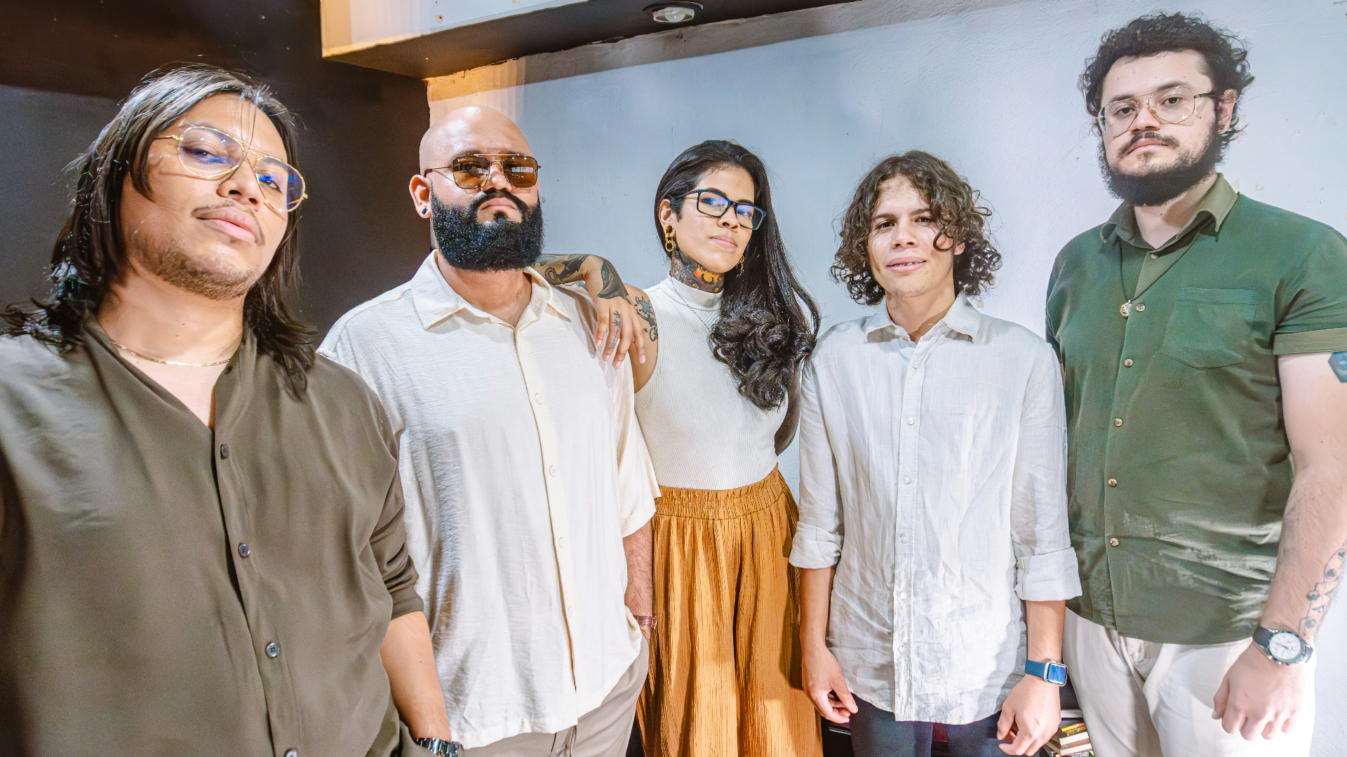 A confident cross-functional team standing together